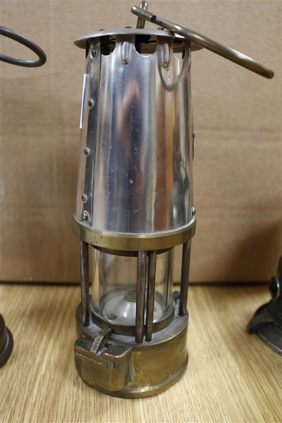 Two miners lamps and a bicycle lamp